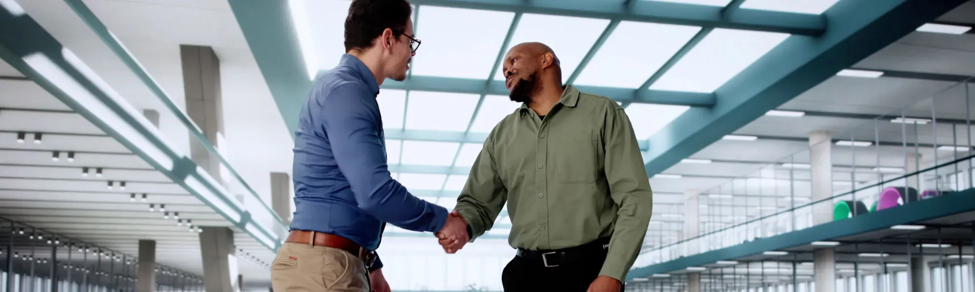Quest employees shaking hands